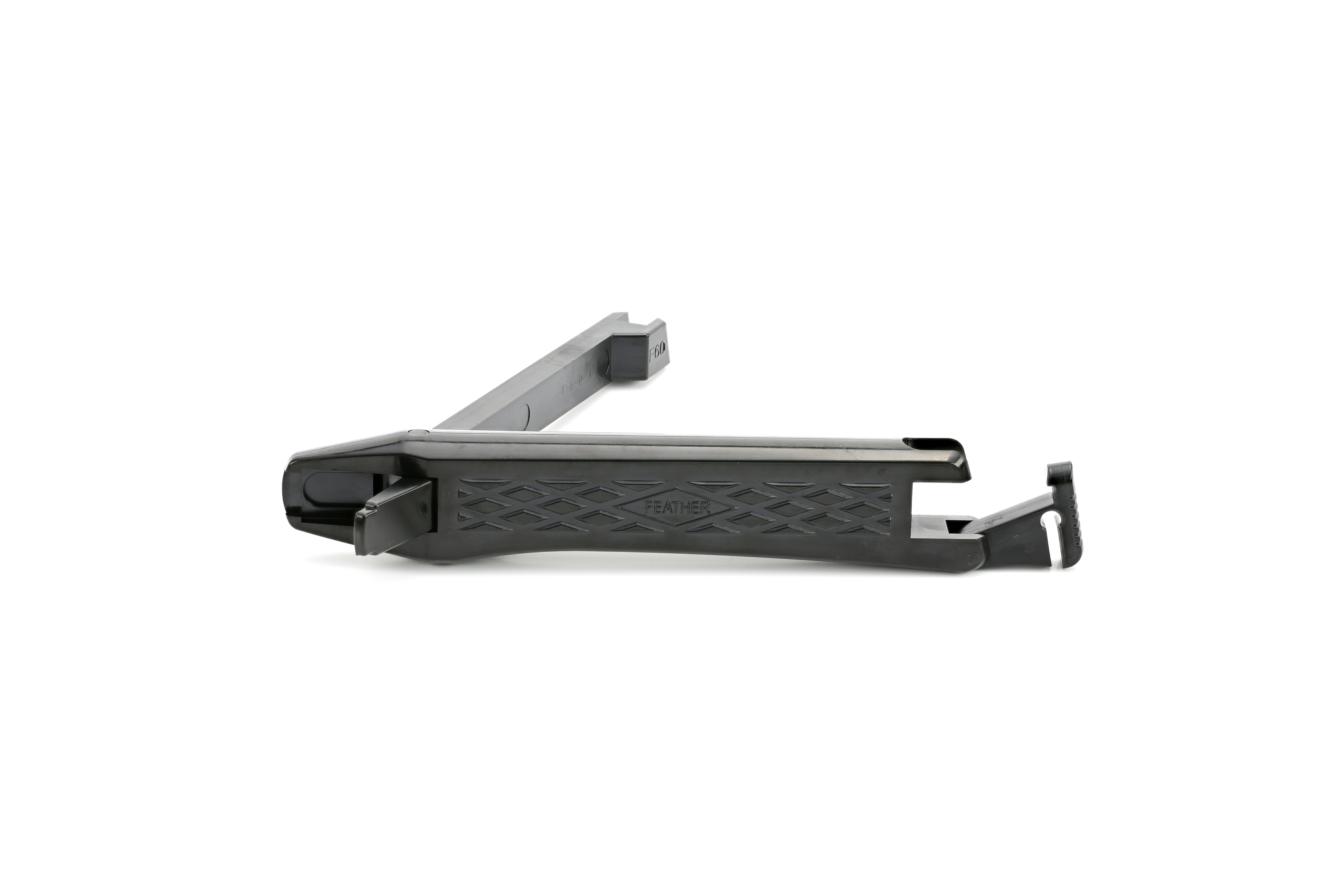 A black plastic automotive trim removal tool with a textured grip, displayed on a white background.