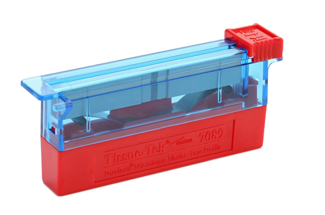 A red and blue laboratory microtome blade dispenser with a transparent cover and a slider for dispensing blades.