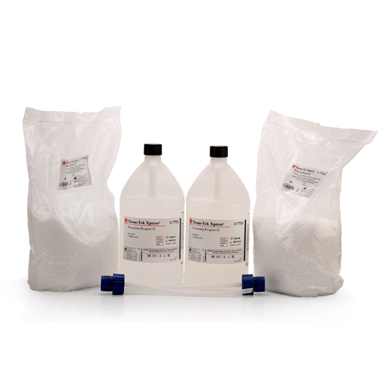 Two bottles of clear liquid and two bags of white powder, each labeled, with two blue-tipped plastic tubes placed in front of them, against a white background.