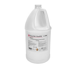 A large white plastic gallon jug labeled “Trans-Tec ClearFIX,” a high viscosity lubricated formalin fixative, with a handle and screw cap.