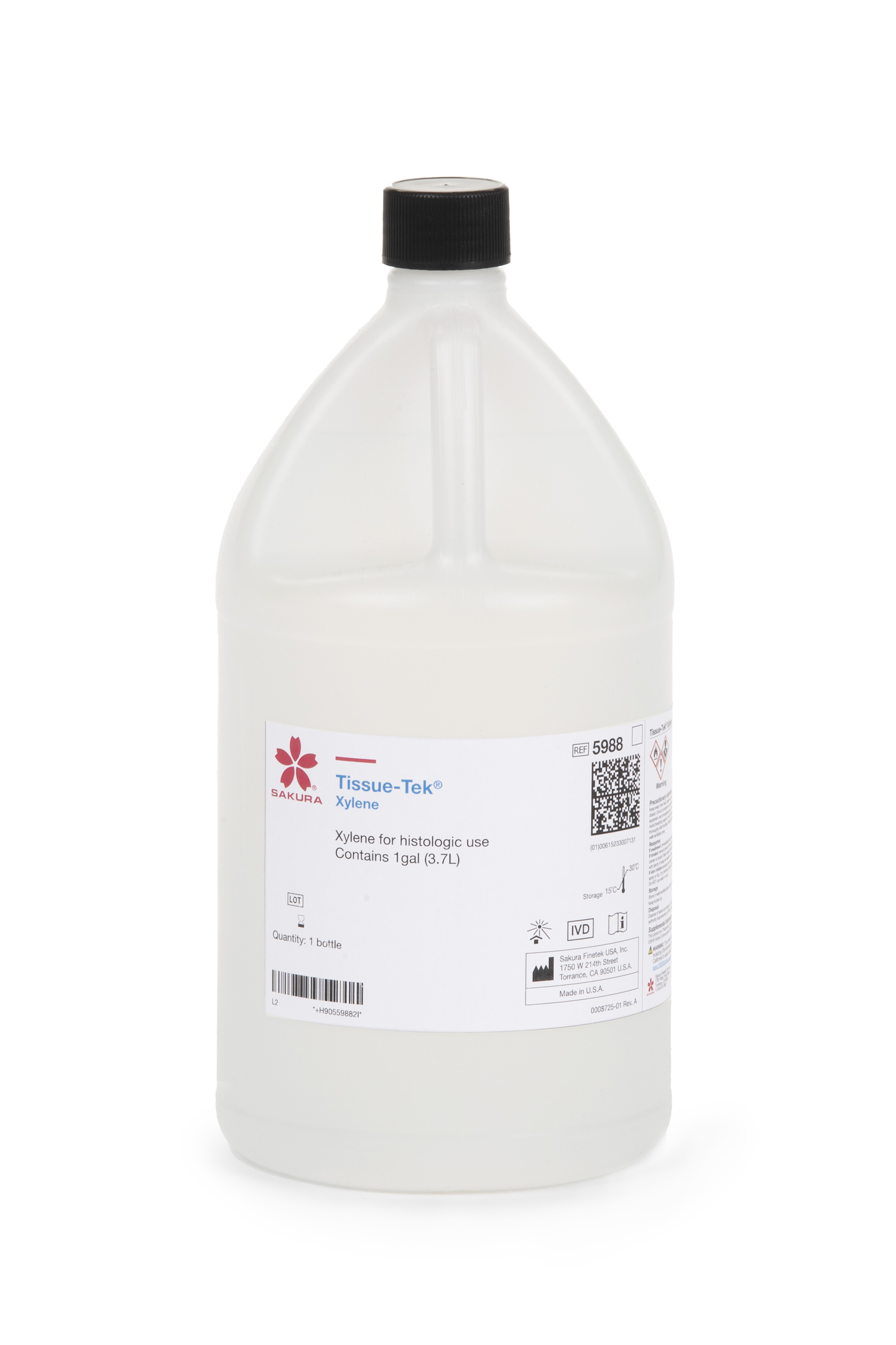 A large clear plastic bottle labeled “Tissue-Tek Xylene” by Sakura, intended for histologic use, with a black screw cap.
