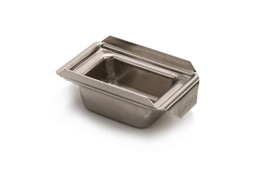 A small, rectangular stainless steel container with a flanged rim, designed for holding or serving food.