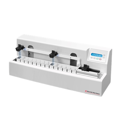 A white, rectangular laboratory instrument with a digital display and controls, designed for precise slicing of samples, is shown against a plain background.