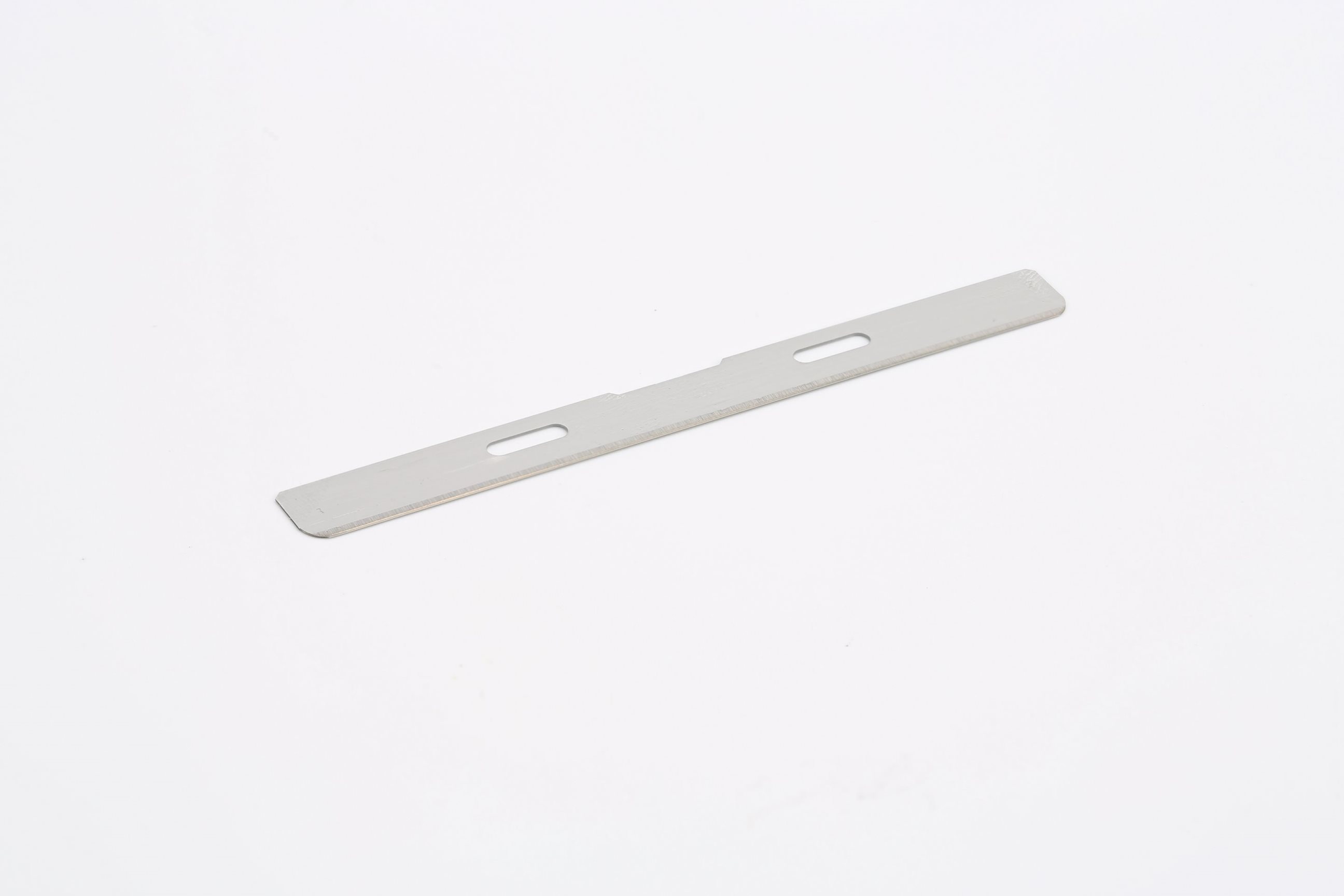 A flat, rectangular metallic strip with two central slots and slightly rounded edges on a white background.