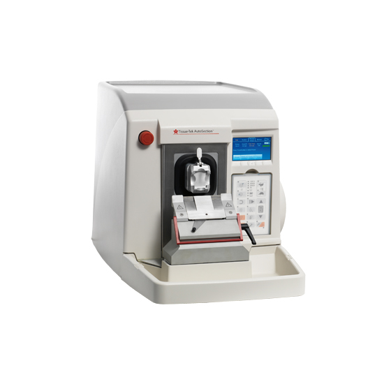A white automated microtome machine with a digital display, used for cutting thin sections of samples for microscopic examination.