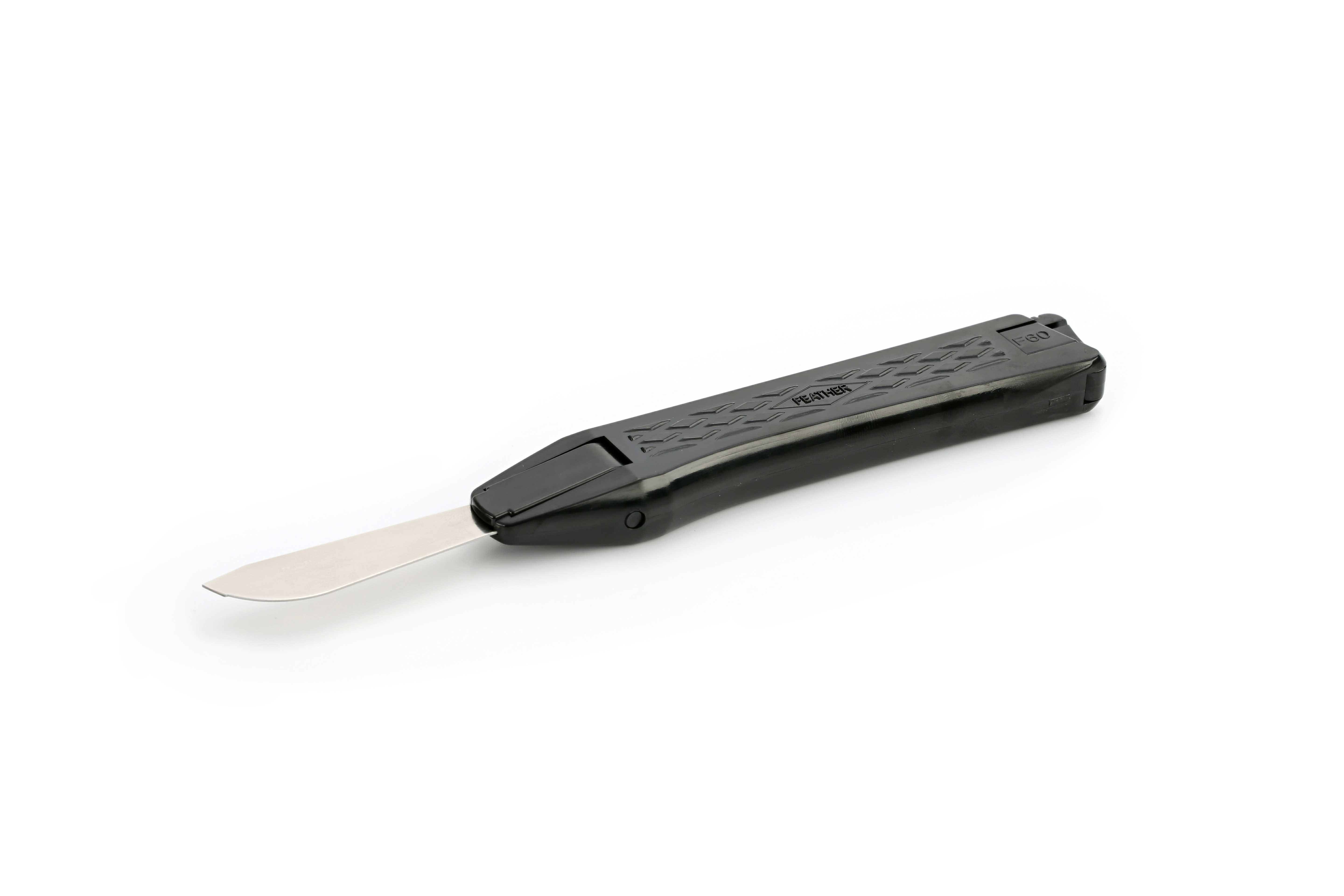 A black plastic handle scalpel with a flat, wide blade is shown against a plain white background.