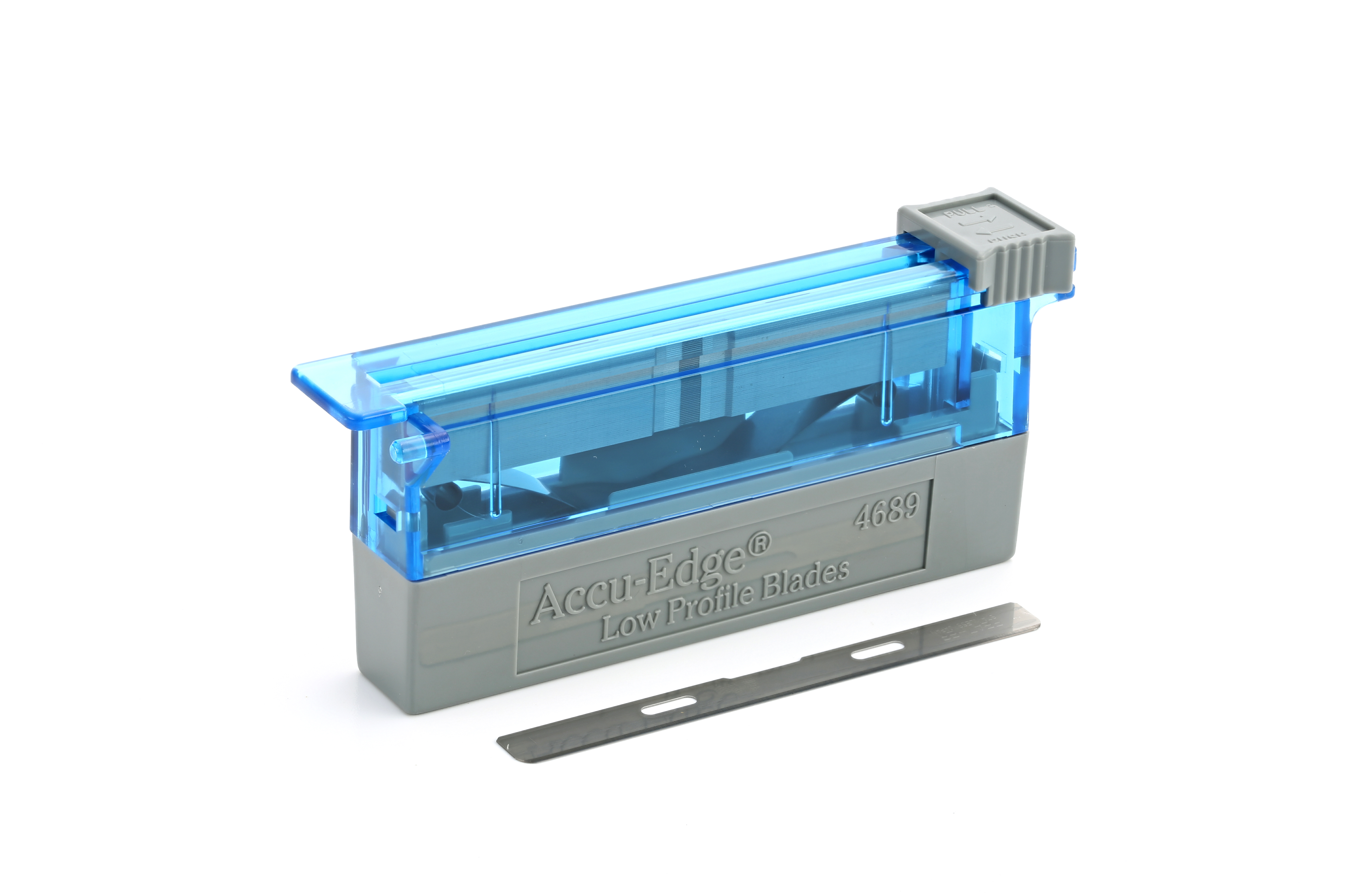 A blue and gray Accu-Edge low profile blade dispenser with one loose razor blade placed in front of it on a white background.