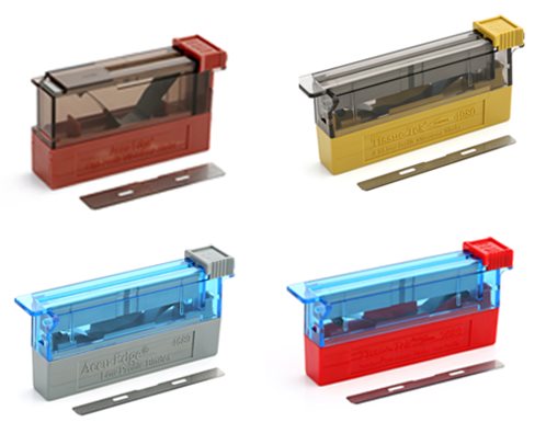 Four rectangular blade dispensers in red, yellow, grey, and blue, each with a matching razor blade placed in front of them on a white background.
