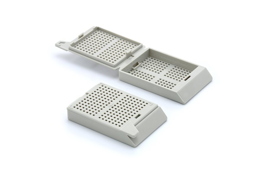A white plastic container with holes.