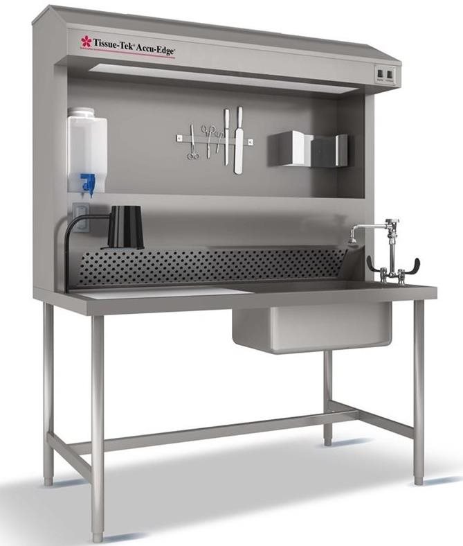 A stainless steel laboratory workstation with a sink, faucet, tools, shelves, paper towel dispenser, and ventilation system.