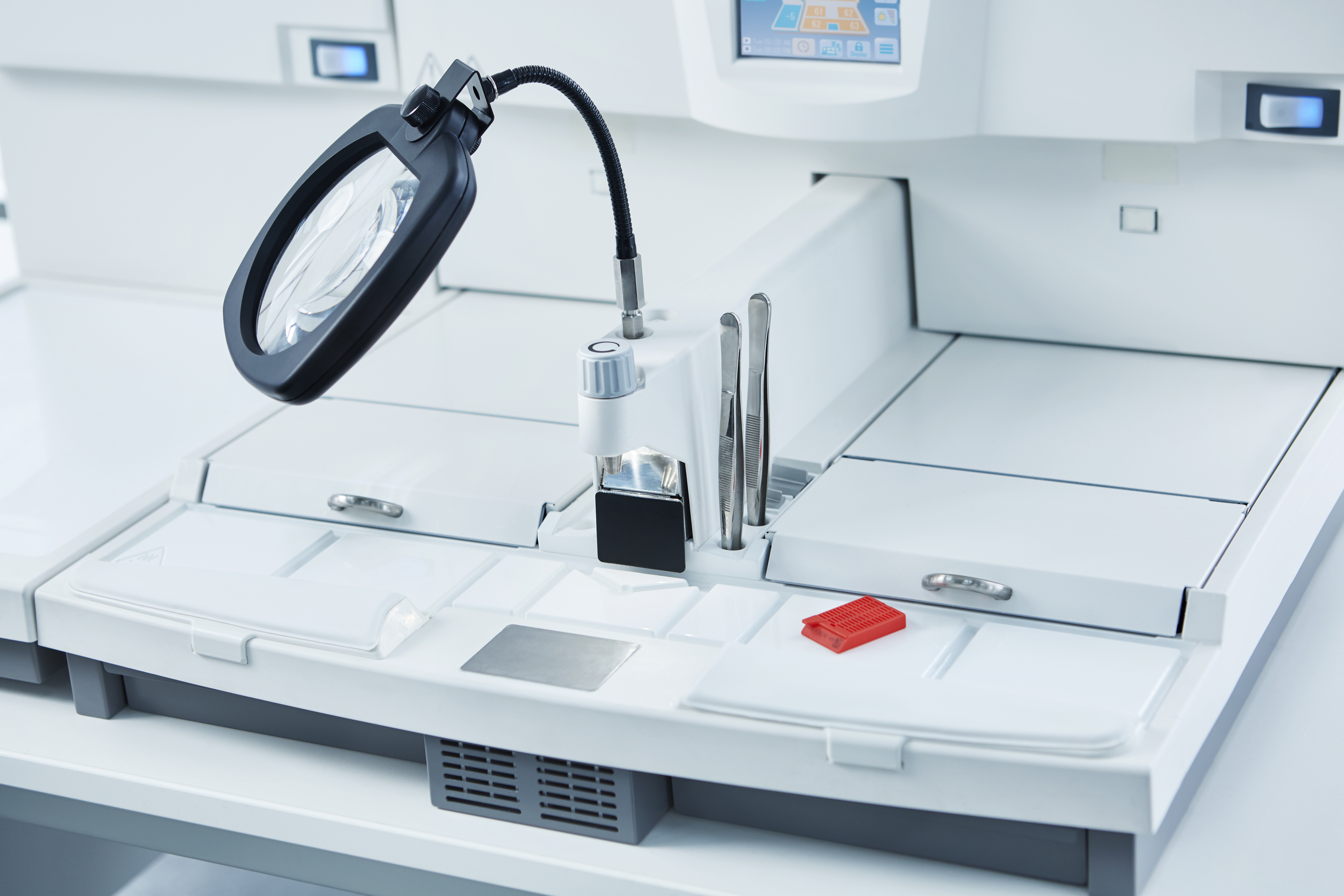 A magnifying glass on a white machine.