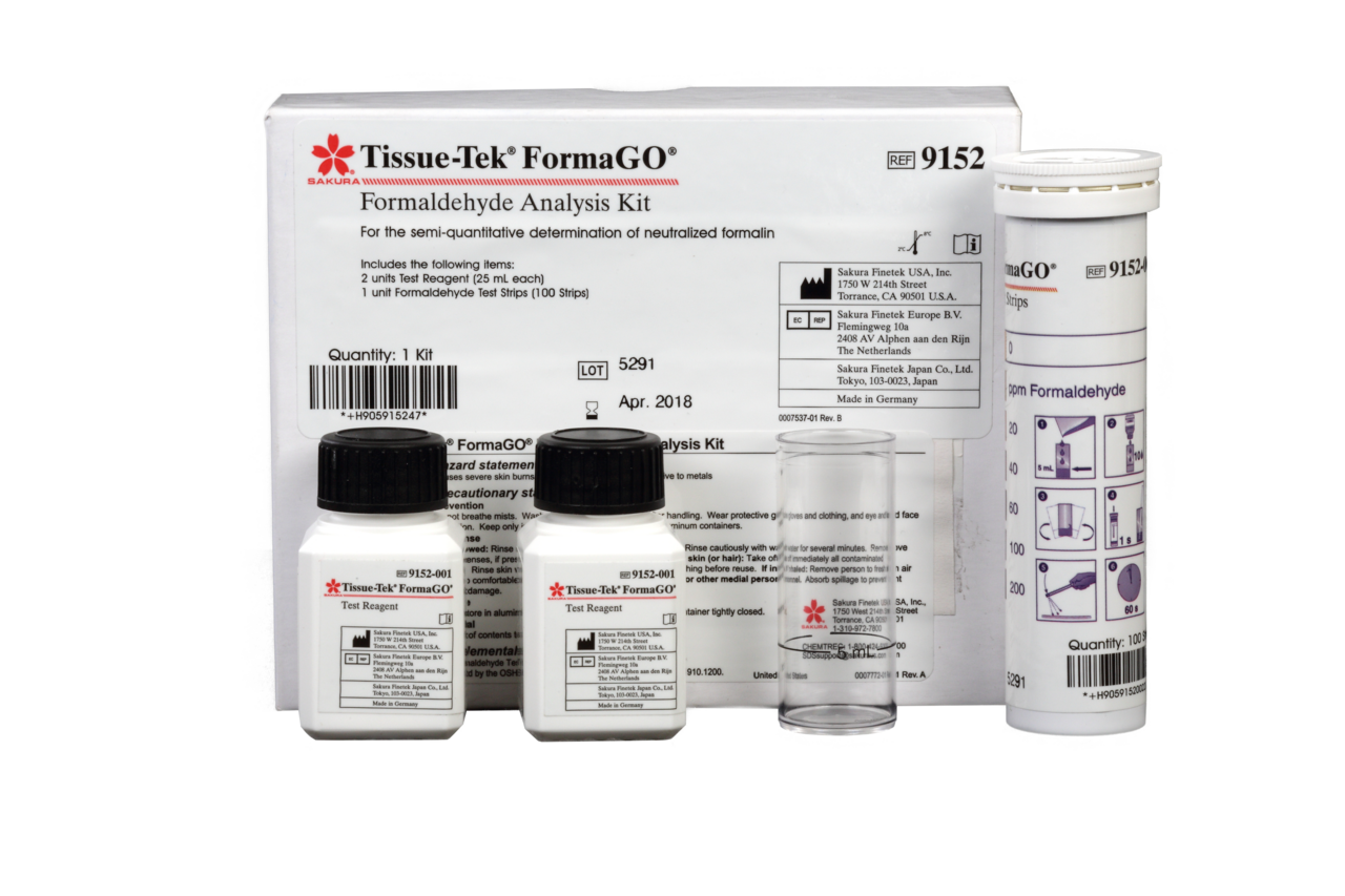 Tissue-Tek FormaGO Formaldehyde Analysis Kit with bottles, a clear cylinder, and tubed accessories displayed in front of labeled packaging.