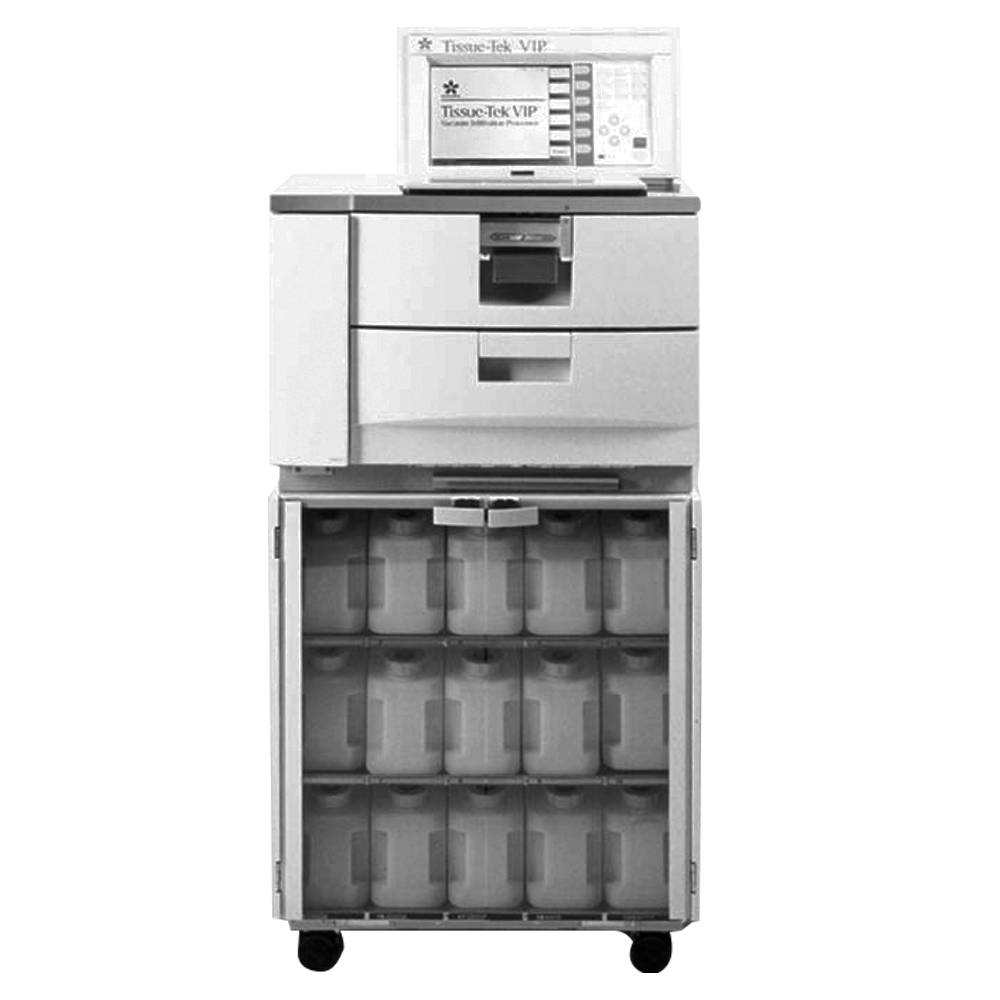 A laboratory tissue processor machine with a digital control panel, multiple compartments, and an open lower section revealing storage containers.
